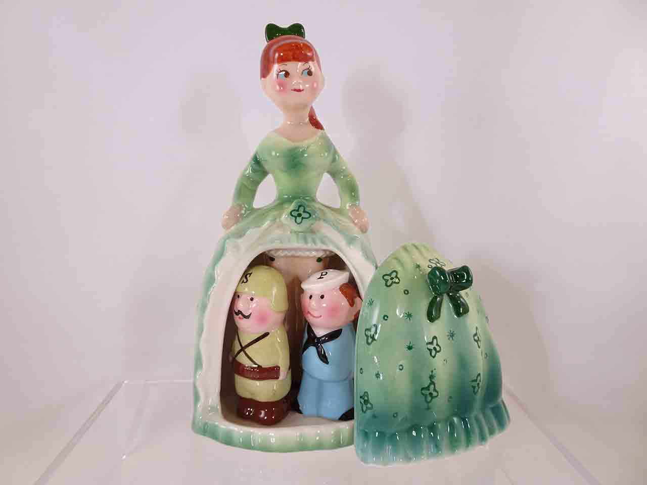 62472 Army and Navy guys hiding beneath lady's dress salt and pepper shakers - green version