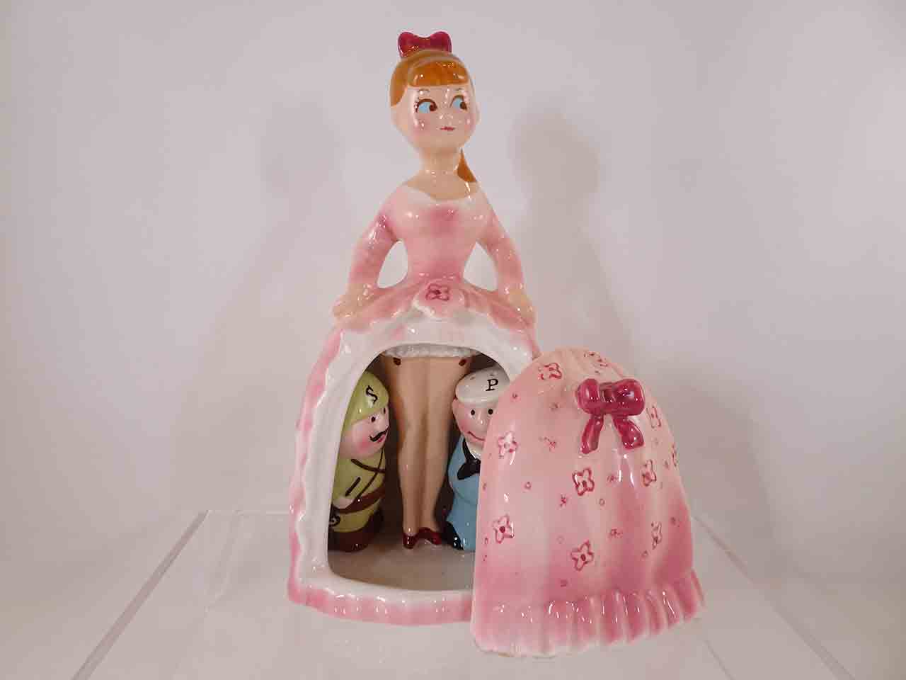 62473 Army and Navy guys hiding beneath lady's dress salt and pepper shakers - pink version