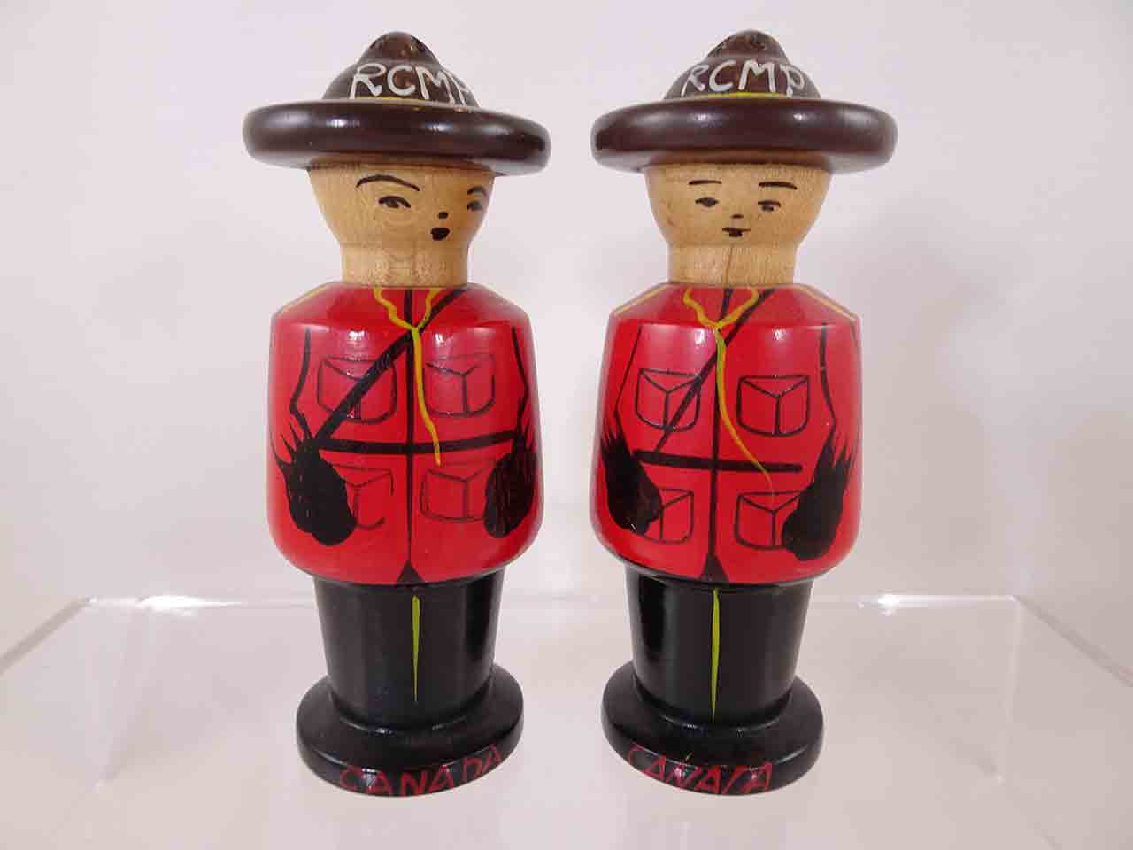 62639 Wooden pair of Royal Canadian Mounted Police salt and pepper shakers