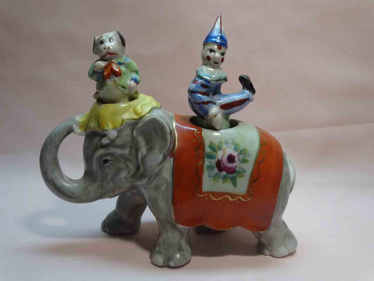 27950 Walking elephant nodder with circus clown and dog as salt and pepper shakers