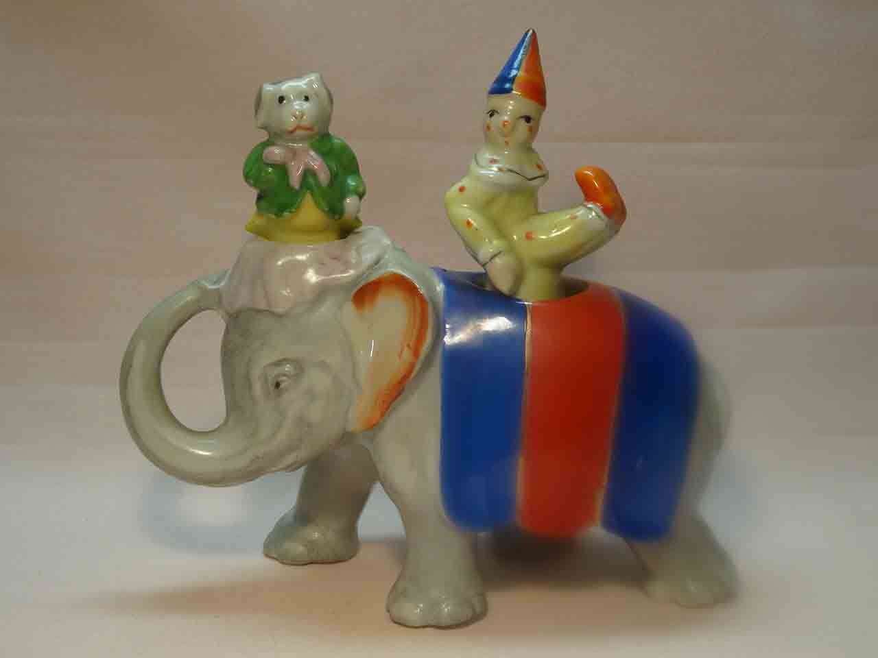 30533 Walking elephant nodder with circus clown and dog as salt and pepper shakers