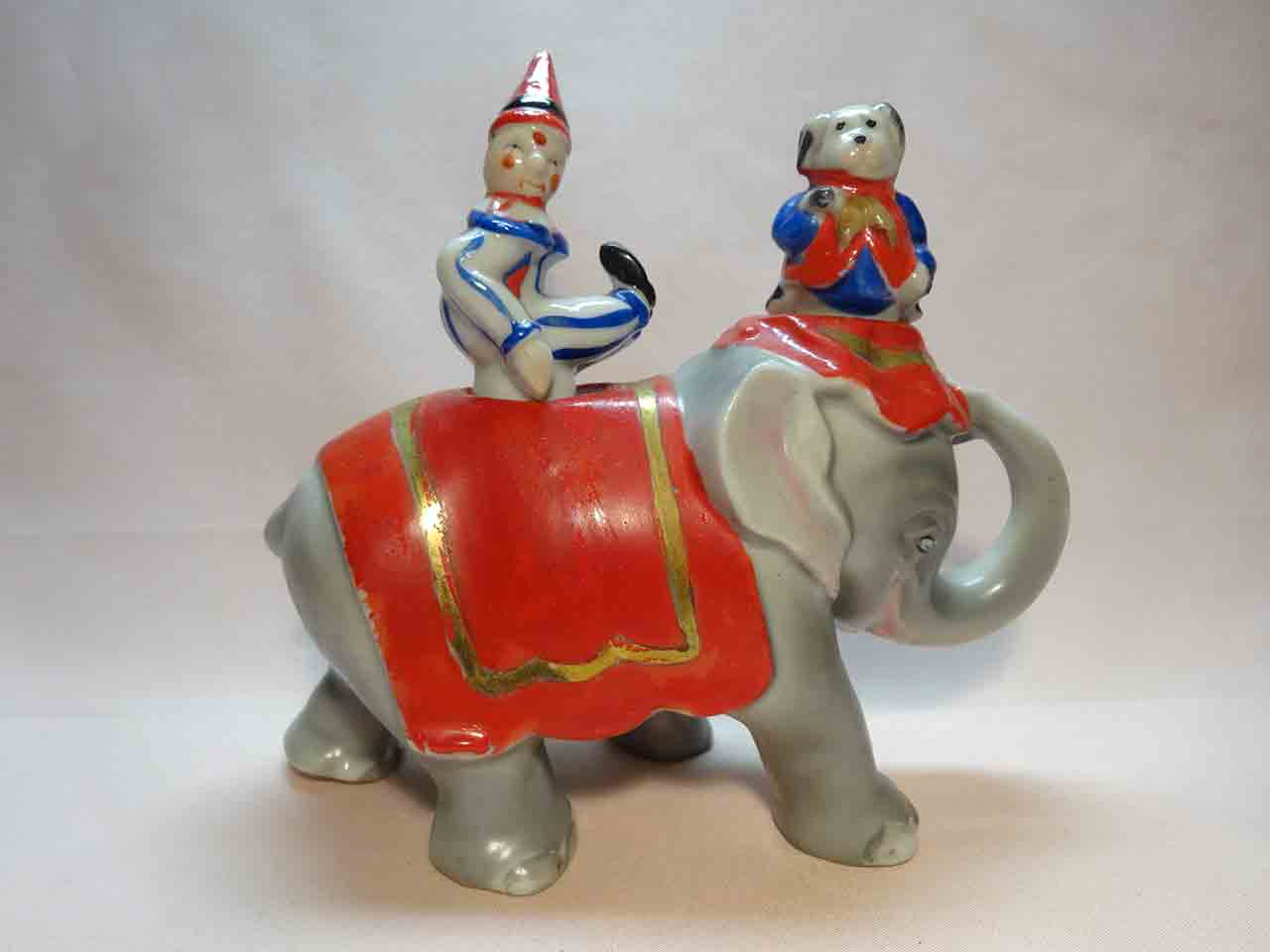 32906 Walking elephant nodder with circus clown and dog as salt and pepper shakers