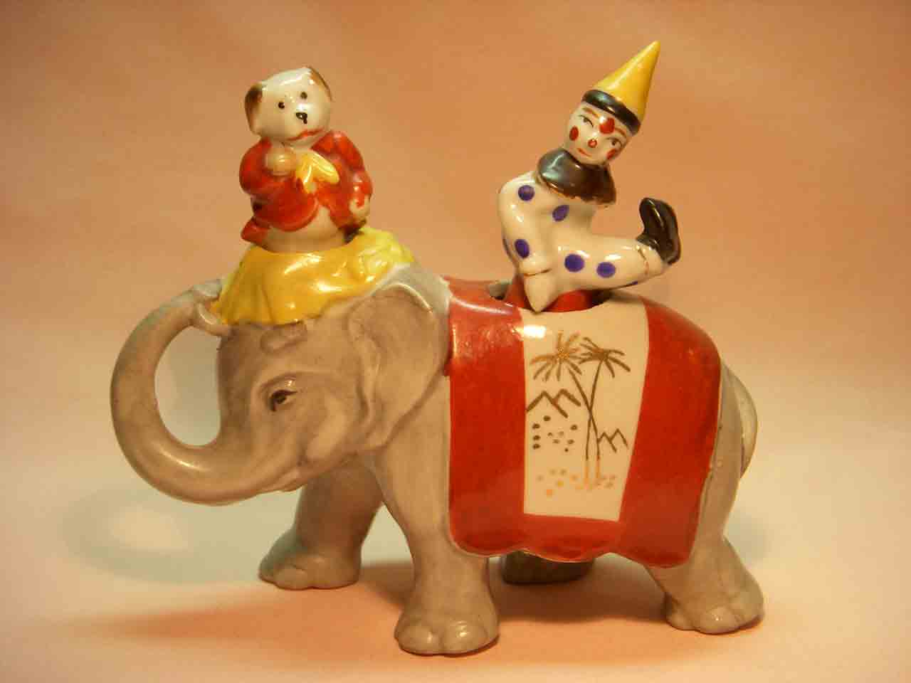18312 Walking elephant nodder with circus clown and dog as salt and pepper shakers