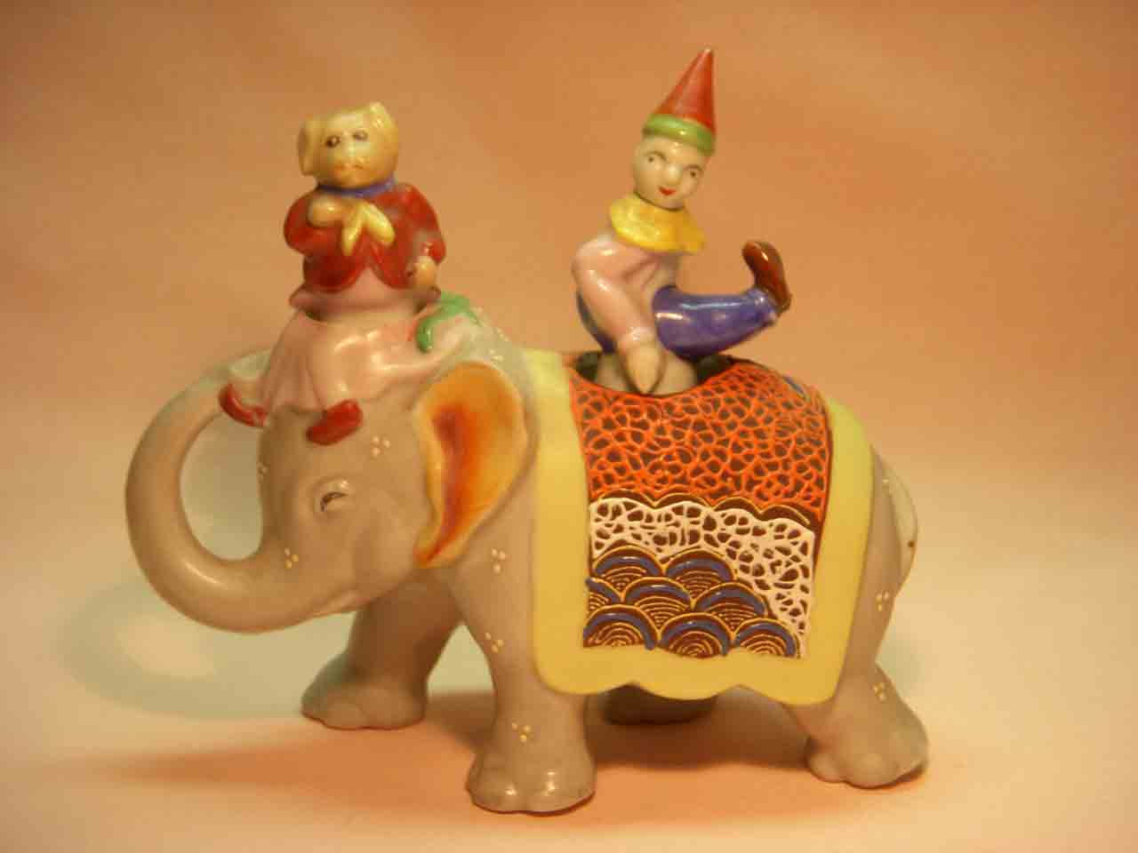 18314 Walking elephant nodder with circus clown and dog as salt and pepper shakers